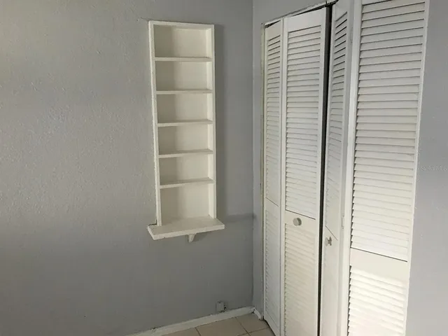 a bathroom with a toilet a sink and a mirror