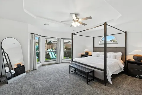 a bed room with furniture and a window