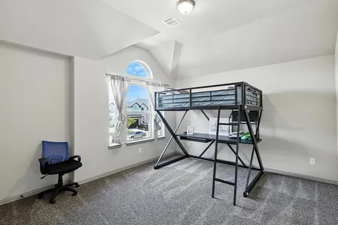 a view of a livingroom with furniture and a window