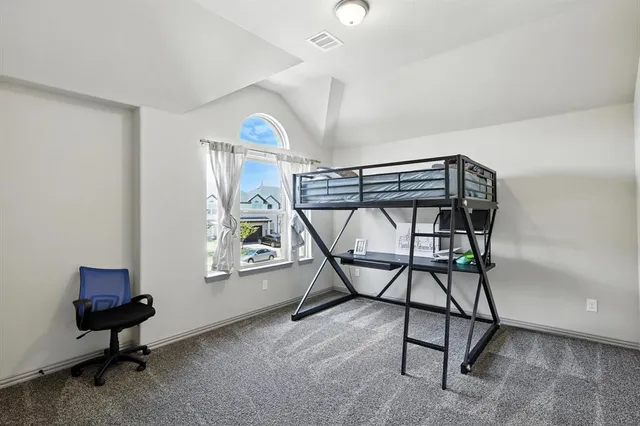 a view of a livingroom with furniture and a window