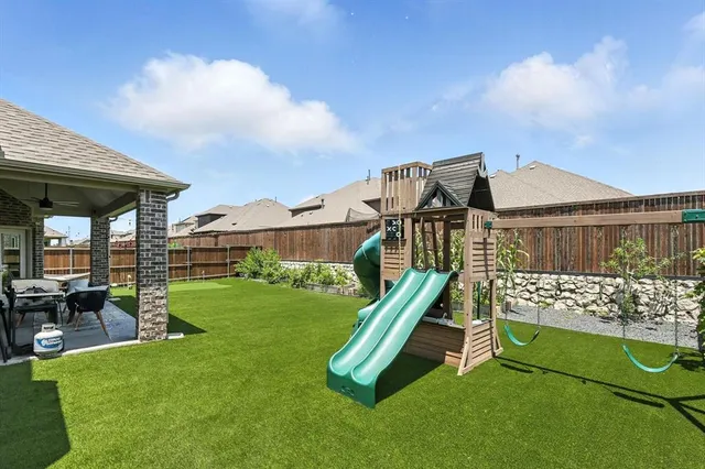 a view of a garden with a slide