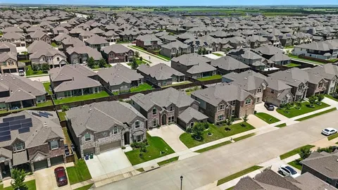 an aerial view of a house with a garden
