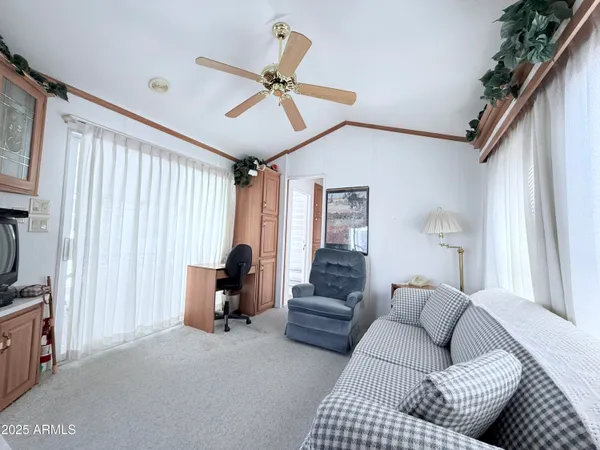 a living room with furniture and a window