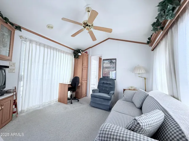 a living room with furniture and a window