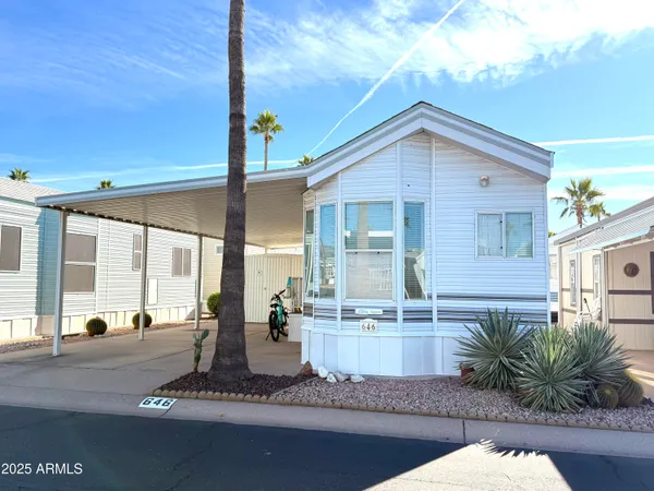 a view of a house with backyard and porch