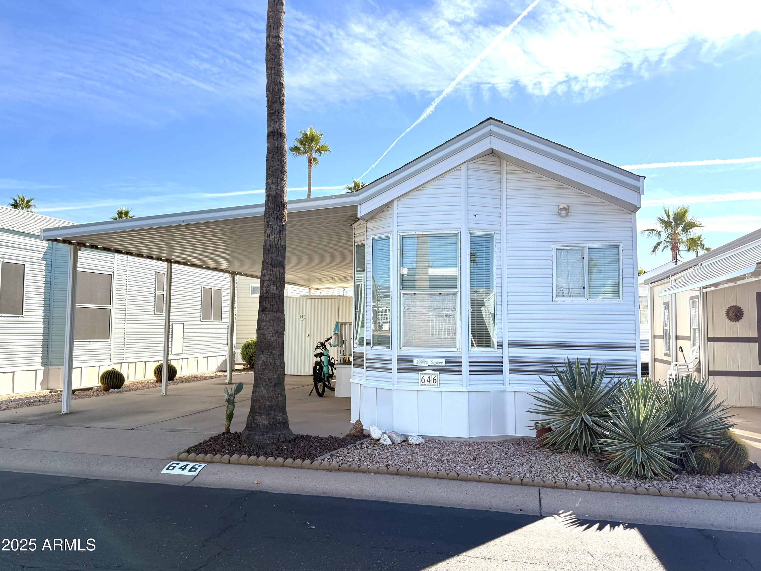 646 Hawks Eye Drive Apache Junction, AZ 85119 - Photo 2 of 17 a view of a house with backyard and porch