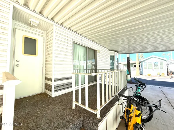 a view of a house with wooden floor and iron stairs