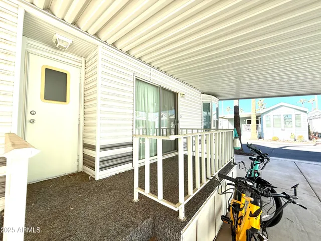 a view of a house with wooden floor and iron stairs