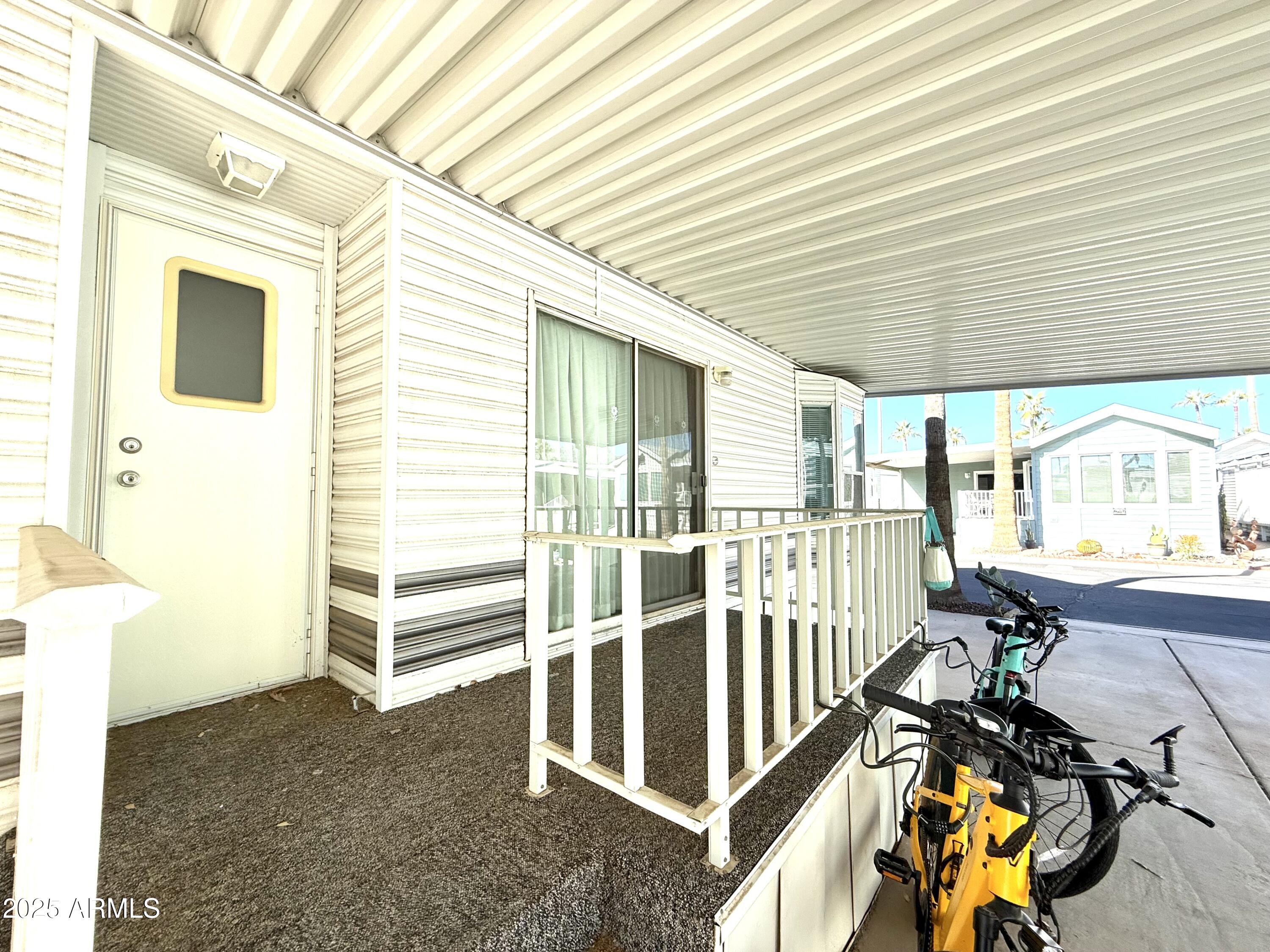 646 Hawks Eye Drive Apache Junction, AZ 85119 - Photo 5 of 17 a view of a house with wooden floor and iron stairs