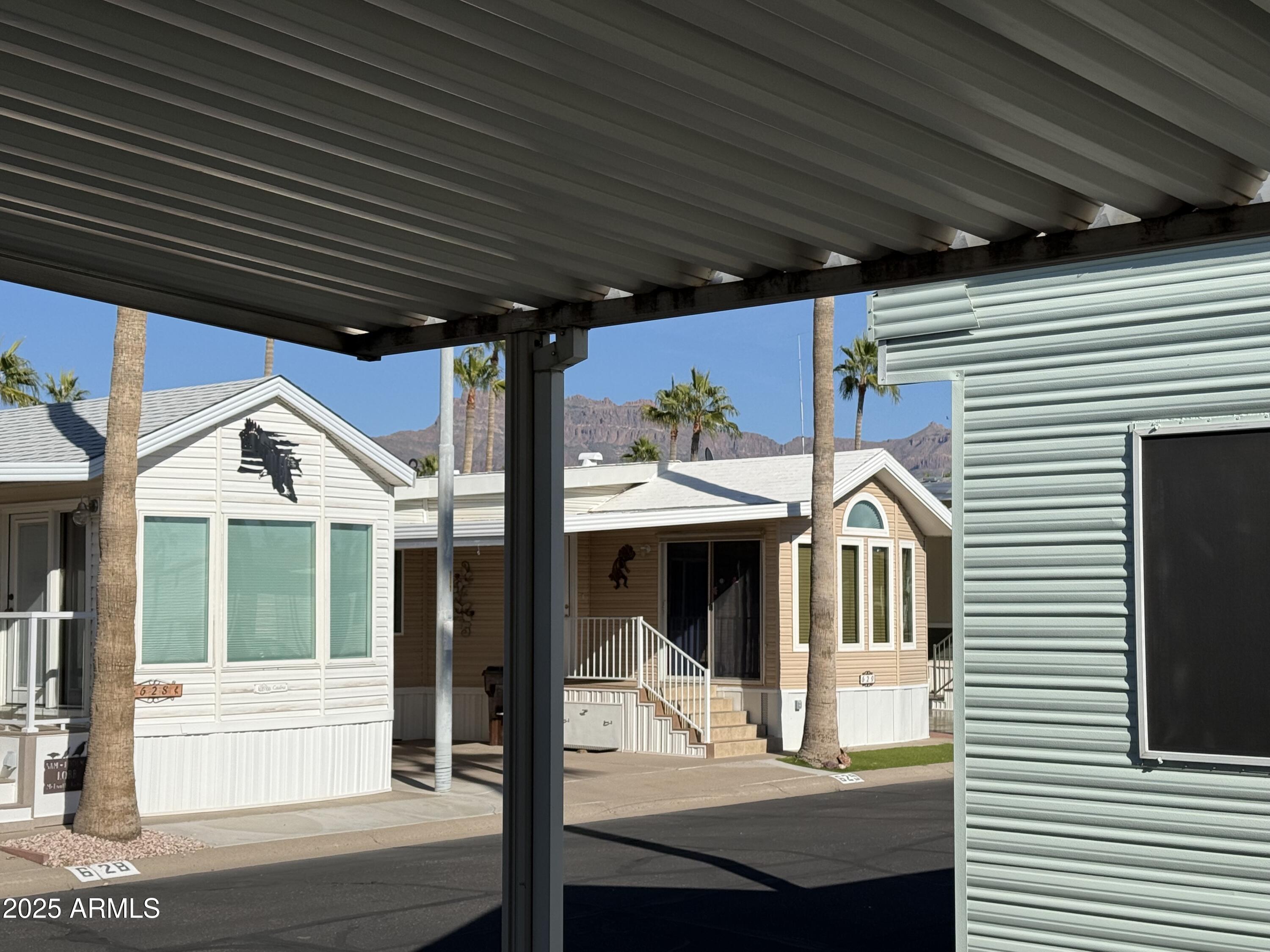 646 Hawks Eye Drive Apache Junction, AZ 85119 - Photo 6 of 17 a view of a house with a porch