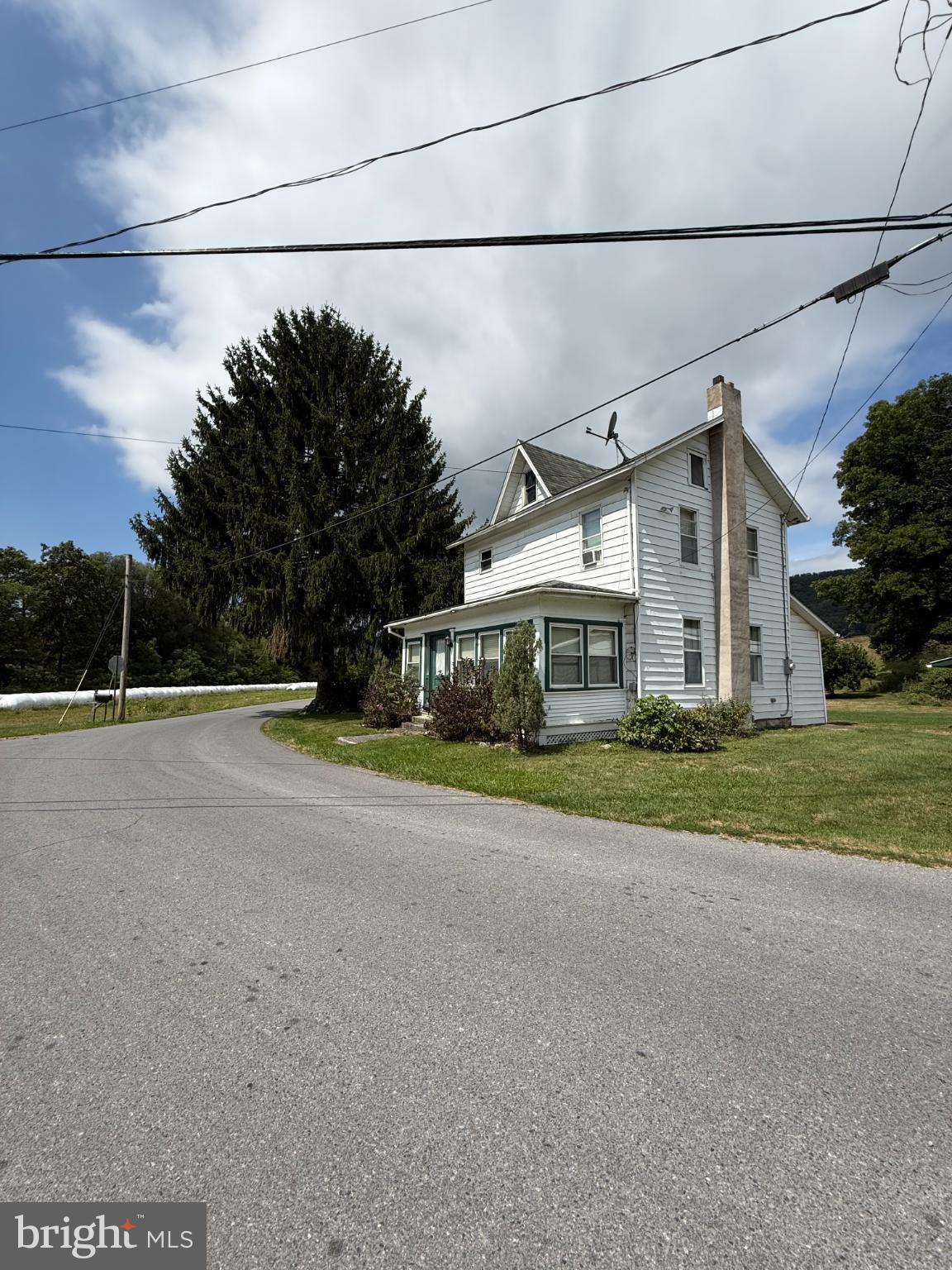 a view of a house with a street