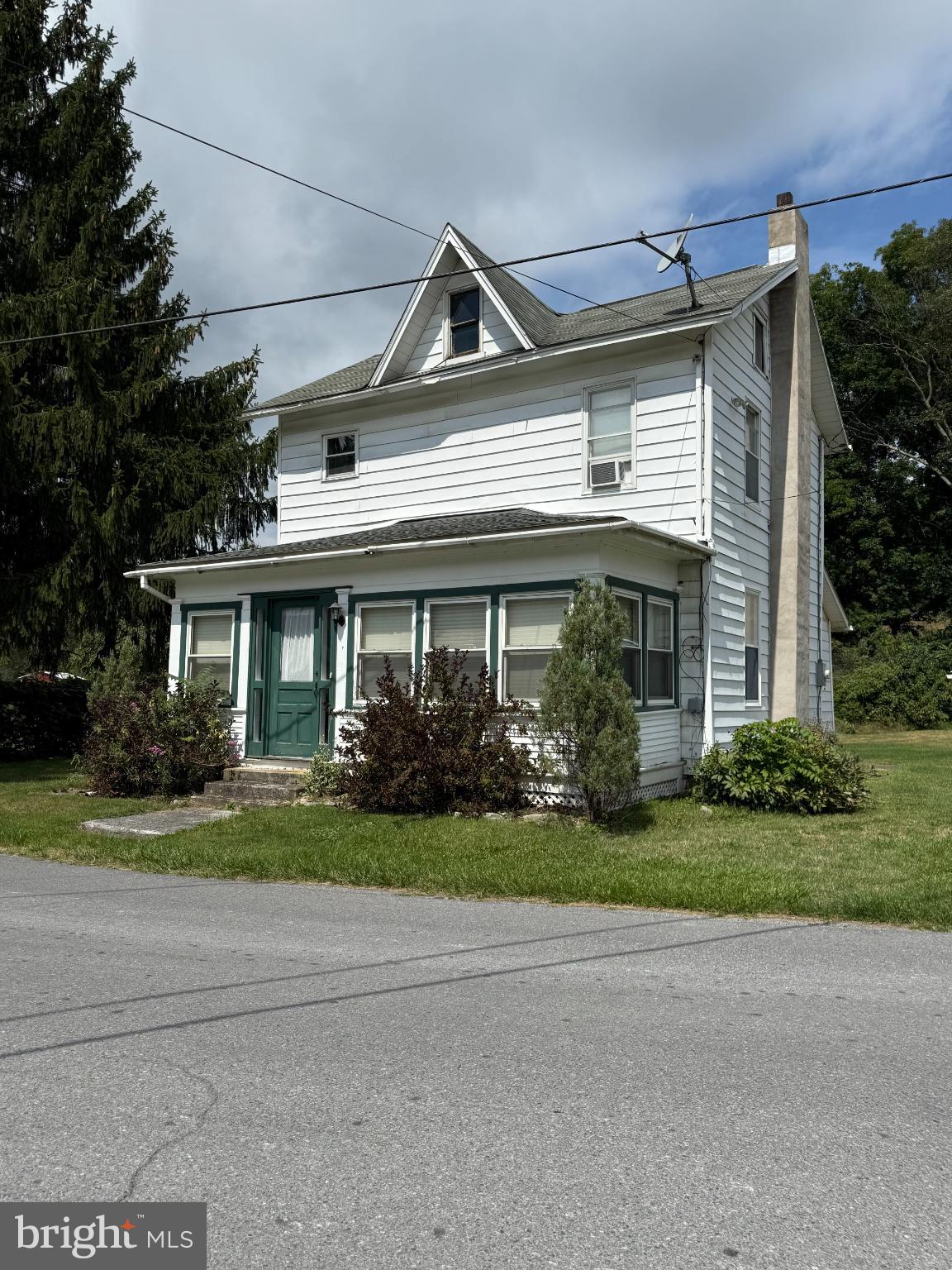 1329 Summer Mountain Road Loganton, PA 17747 - Photo 12 of 56 a front view of a house with a garden and plants