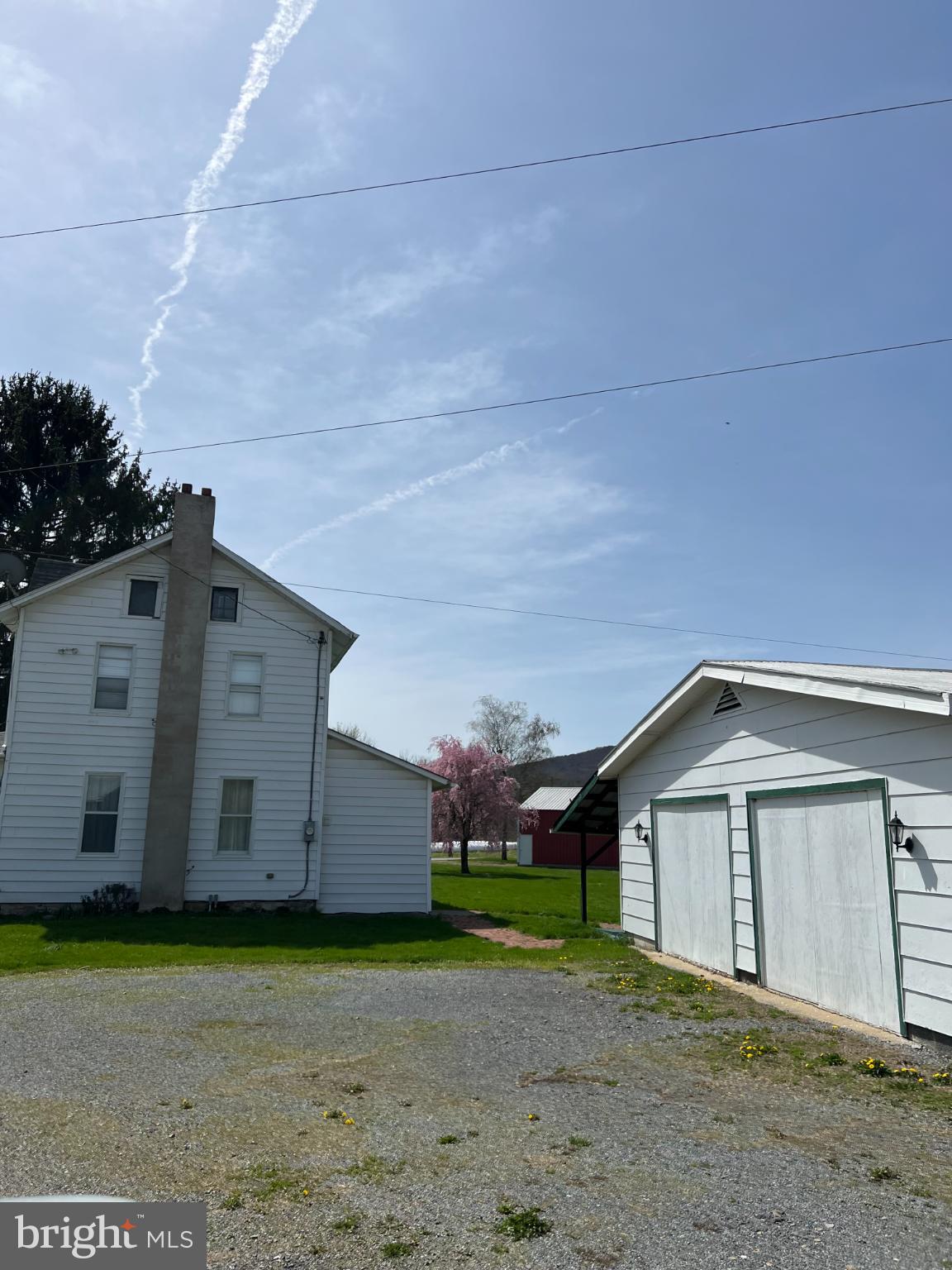 1329 Summer Mountain Road Loganton, PA 17747 - Photo 13 of 56 a view of a house with a yard and a large parking space
