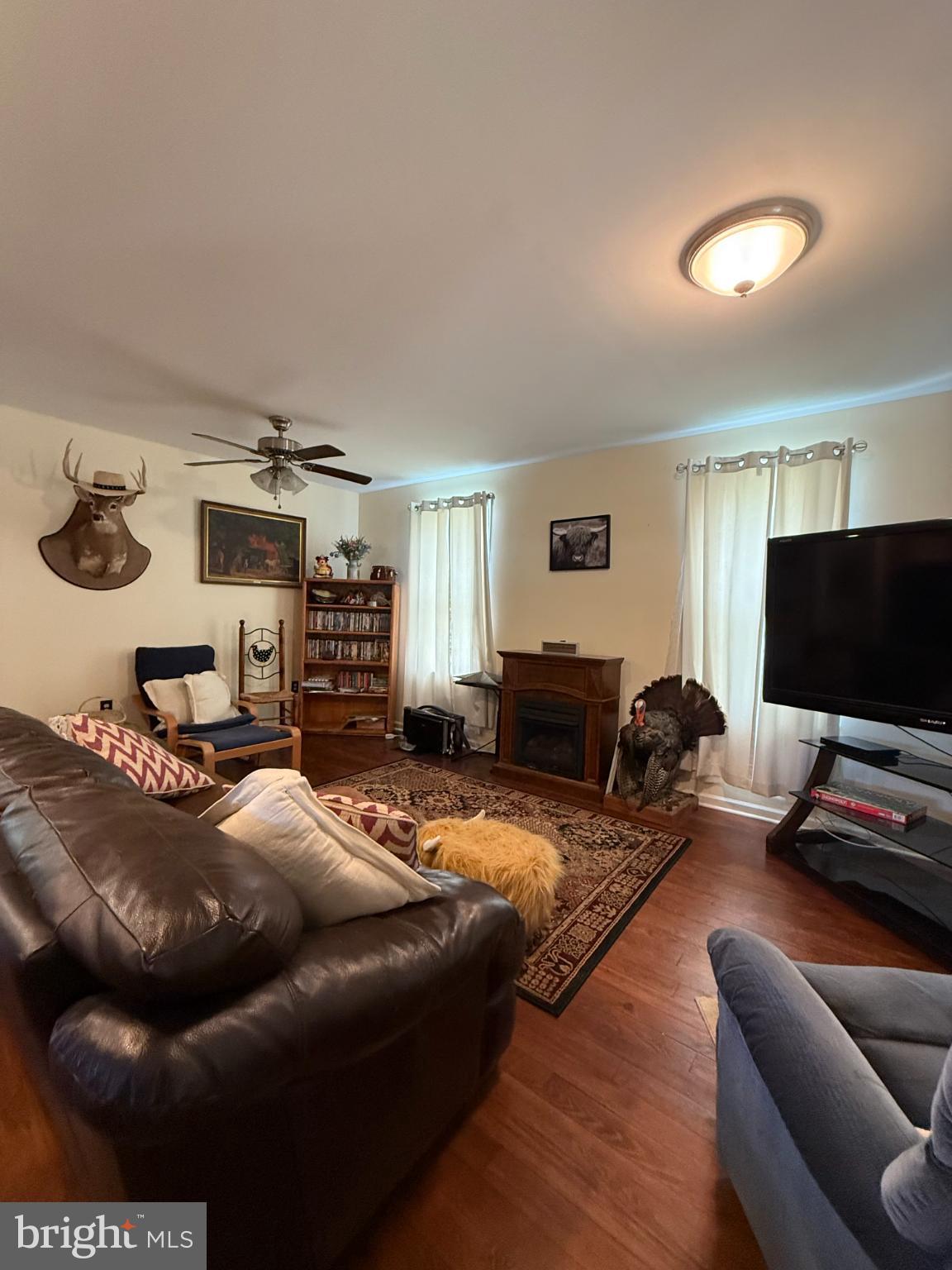 1329 Summer Mountain Road Loganton, PA 17747 - Photo 25 of 56 a living room with furniture and a flat screen tv
