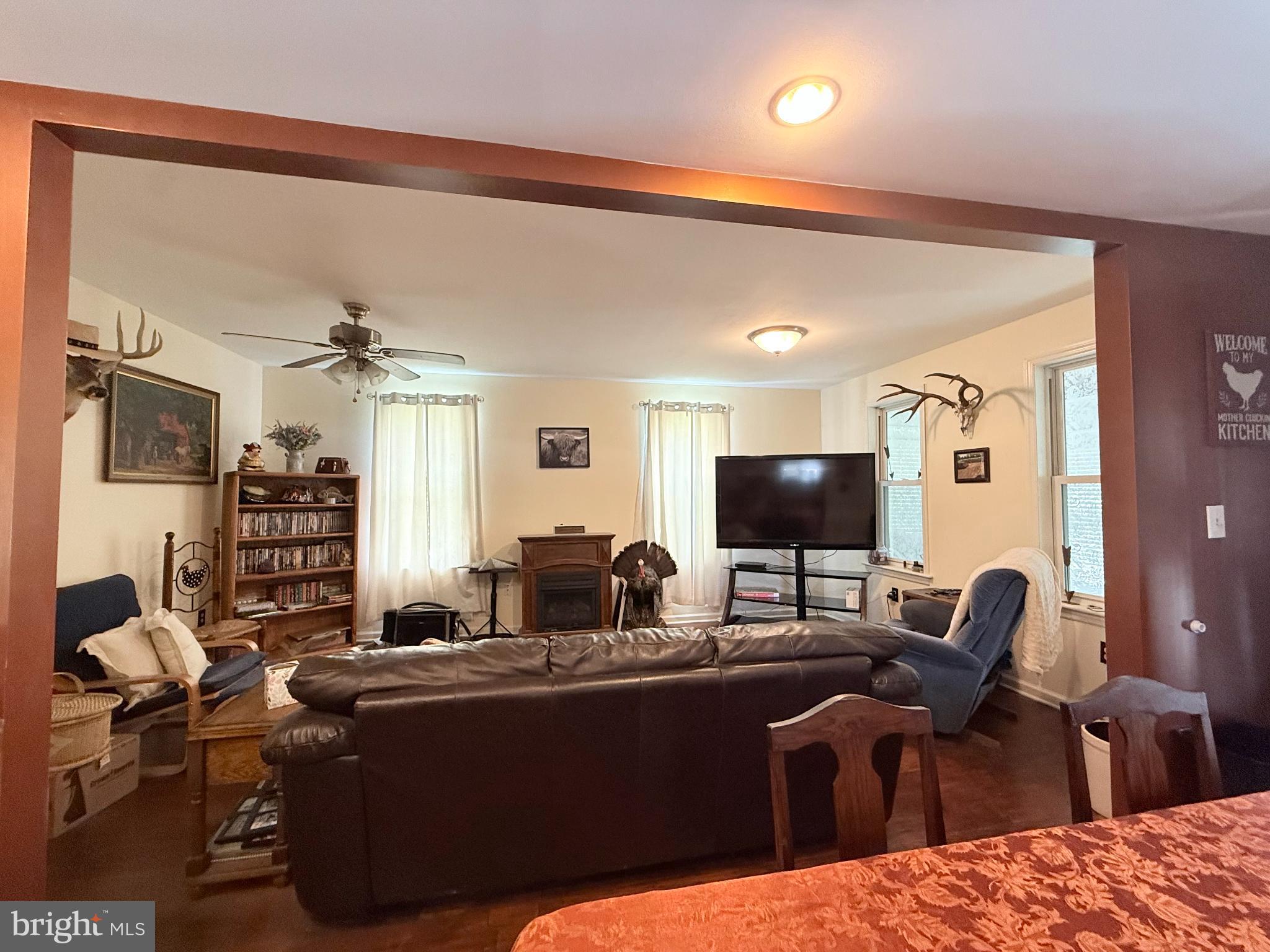 1329 Summer Mountain Road Loganton, PA 17747 - Photo 26 of 56 a living room with furniture and a flat screen tv