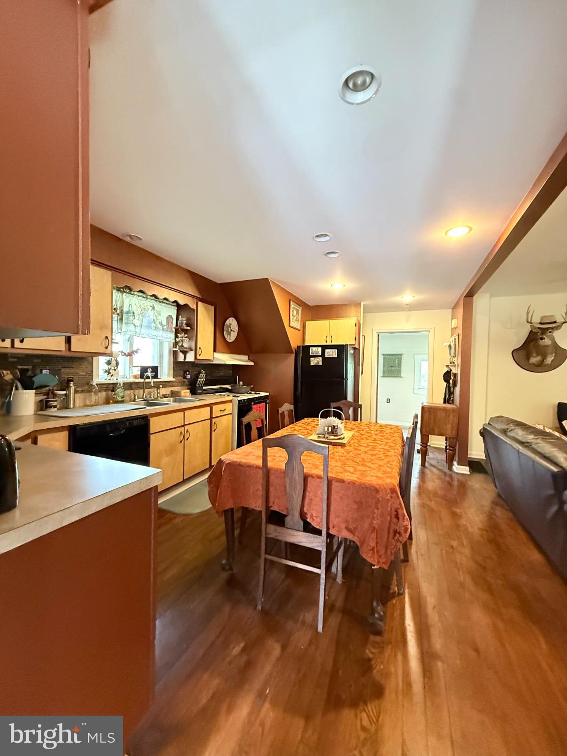 1329 Summer Mountain Road Loganton, PA 17747 - Photo 27 of 56 a view of a dining room with furniture window and wooden floor
