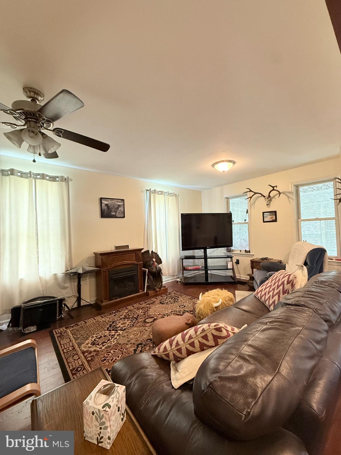 1329 Summer Mountain Road Loganton, PA 17747 - Photo 29 of 56 a living room with furniture and a flat screen tv