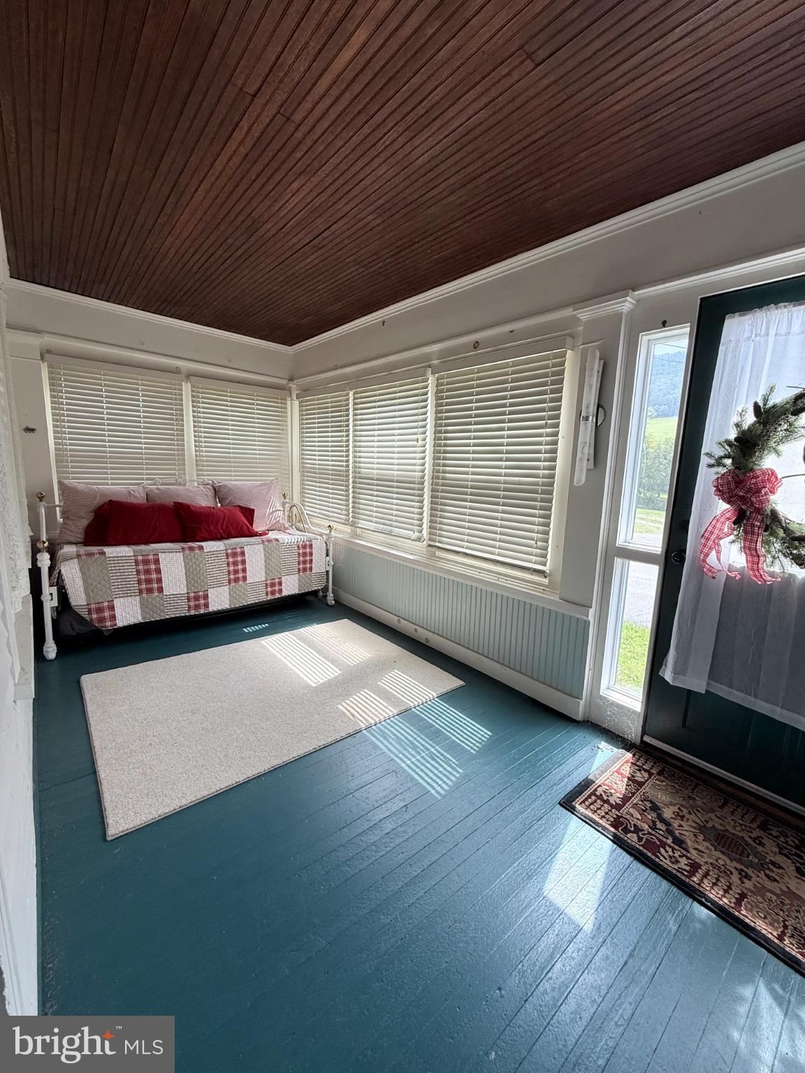 1329 Summer Mountain Road Loganton, PA 17747 - Photo 34 of 56 a view of an empty room with furniture and a window
