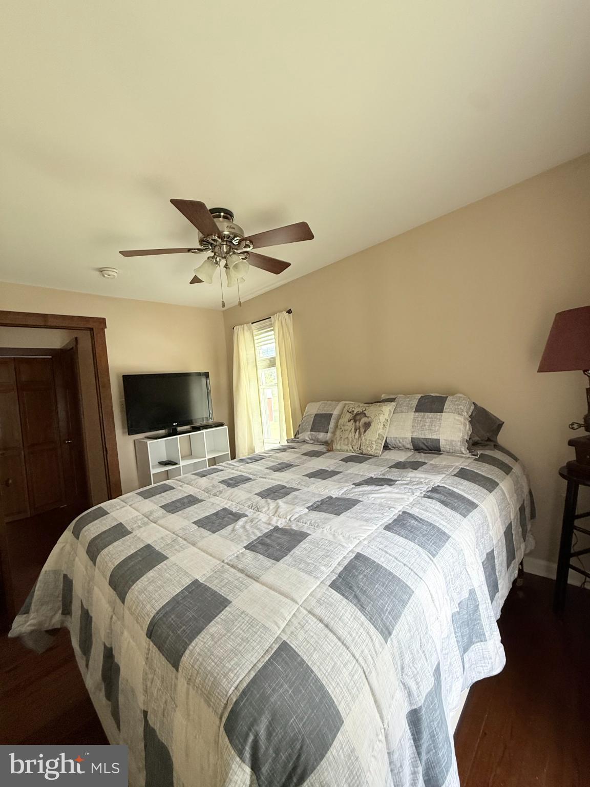 1329 Summer Mountain Road Loganton, PA 17747 - Photo 40 of 56 a bedroom with a bed and a ceiling fan