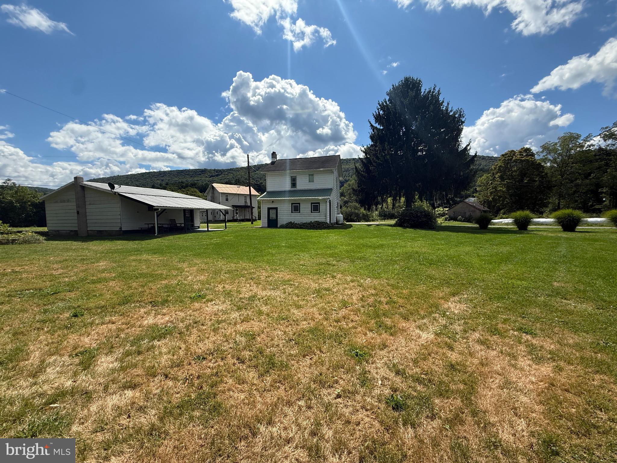 1329 Summer Mountain Road Loganton, PA 17747 - Photo 49 of 56 a view of a house with a yard and sitting area