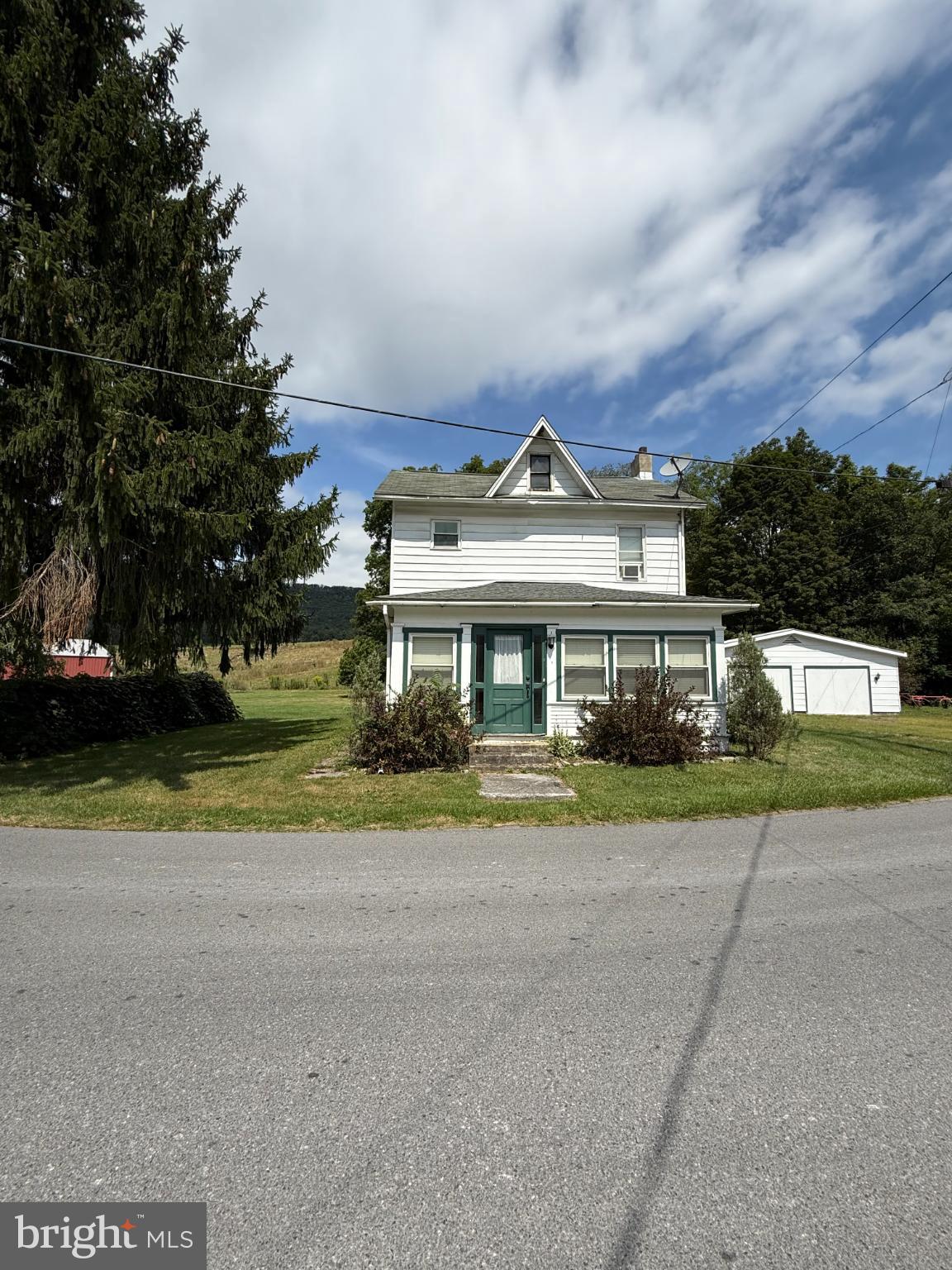 1329 Summer Mountain Road Loganton, PA 17747 - Photo 9 of 56 front view of a house with a yard and potted plants