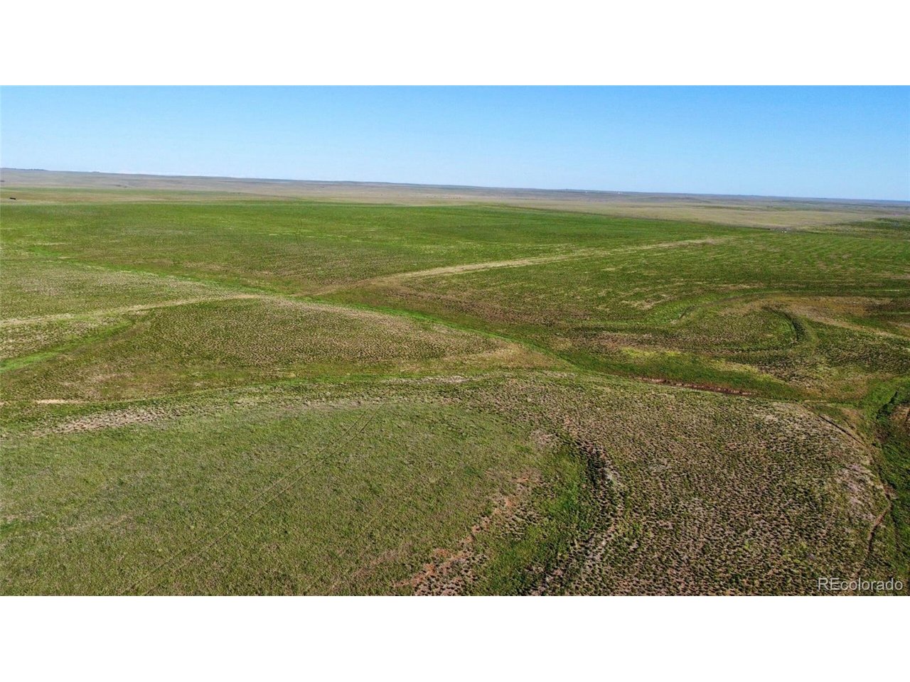 166 County Road Deer Trail, CO 80105 - Photo 3 of 10 a open area with a yard