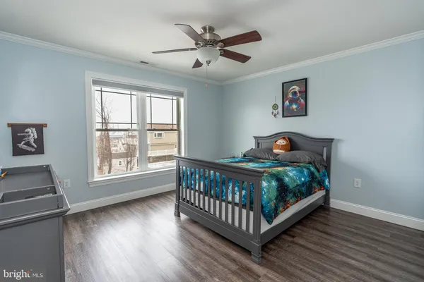 a bedroom with bed and a window
