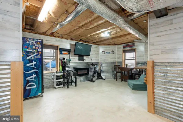 a view of a livingroom with furniture and a fireplace
