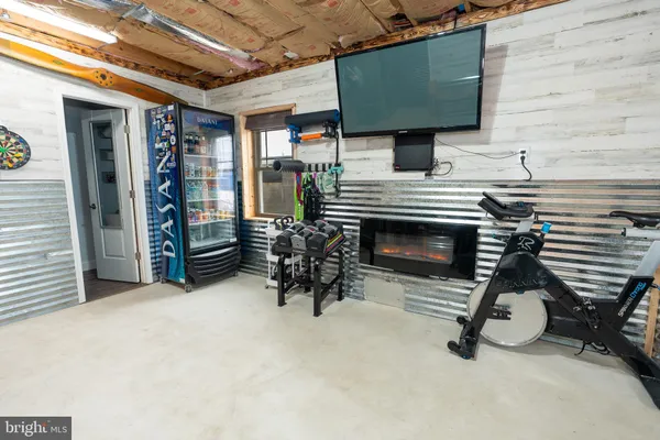 a view of livingroom with furniture and a fireplace