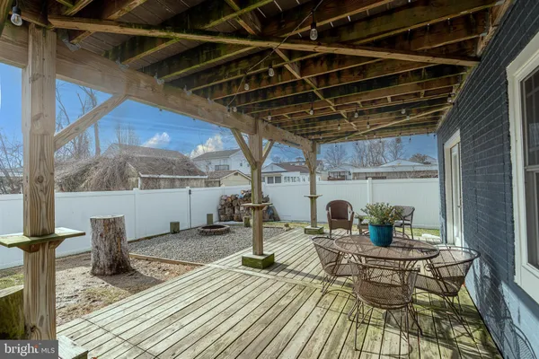 a view of backyard with a table and chairs