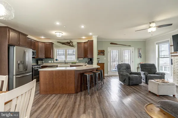 a large kitchen with stainless steel appliances lots of counter top space