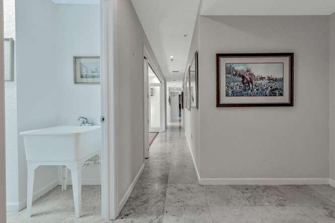 1640 Presidential Way, Unit 501 West Palm Beach, FL 33401 - Photo 20 of 36 a view of a hallway with workspace