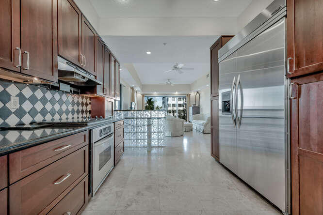 1640 Presidential Way, Unit 501 West Palm Beach, FL 33401 - Photo 2 of 36 a kitchen with stainless steel appliances granite countertop a refrigerator and a sink