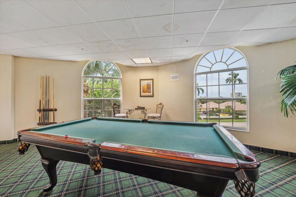 1640 Presidential Way, Unit 501 West Palm Beach, FL 33401 - Photo 33 of 36 a room with pool table and windows