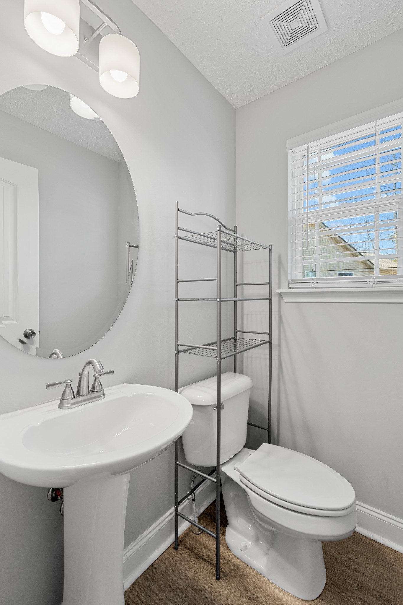 839 Cedar Lane Springfield, TN 37172 - Photo 12 of 34 a bathroom with a sink a toilet and a mirror