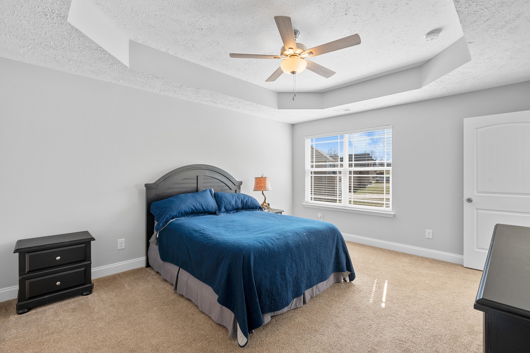 839 Cedar Lane Springfield, TN 37172 - Photo 14 of 34 a bedroom with a bed and a chandelier