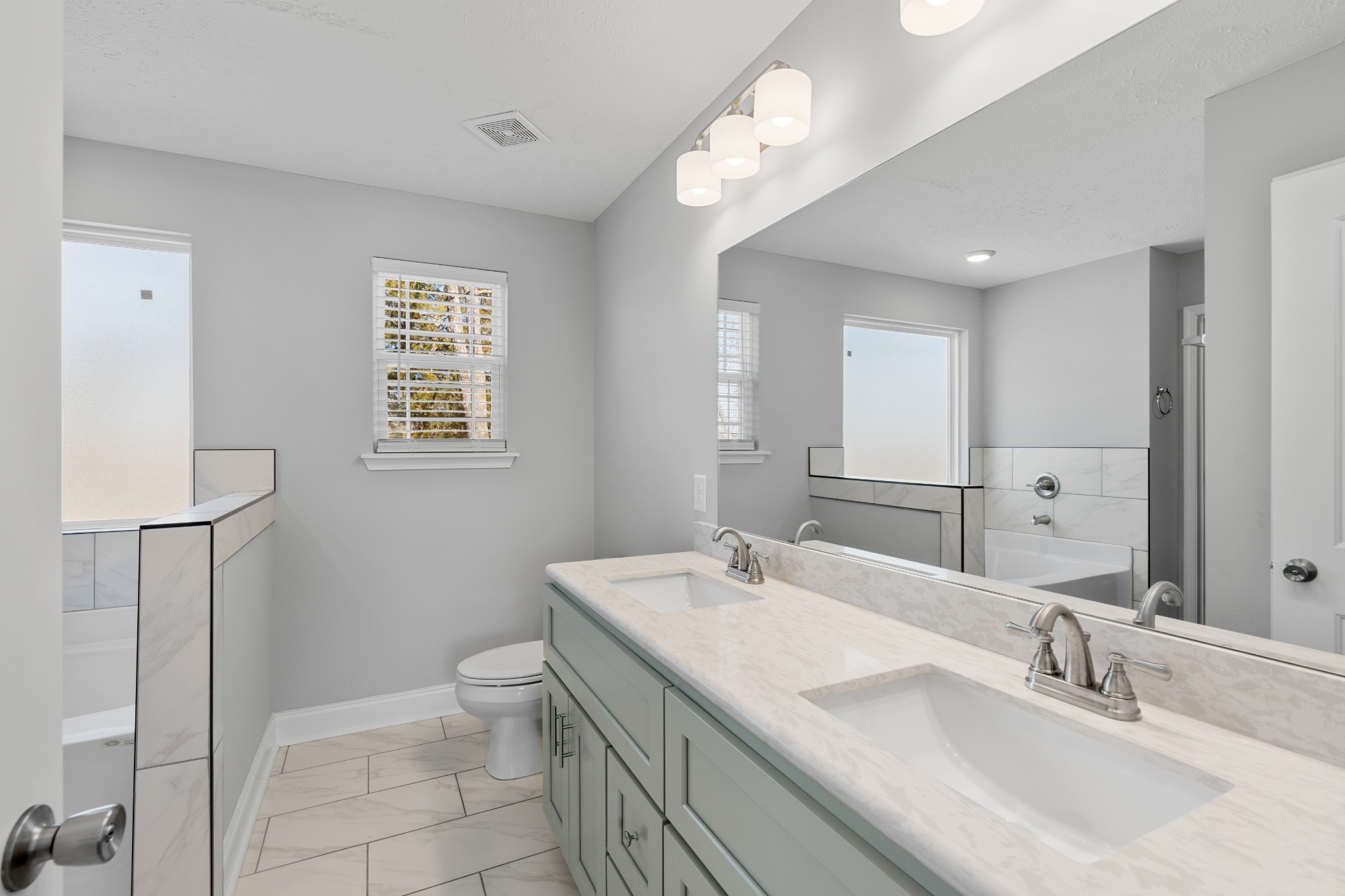 839 Cedar Lane Springfield, TN 37172 - Photo 15 of 34 a bathroom with a granite countertop sink a toilet and a mirror