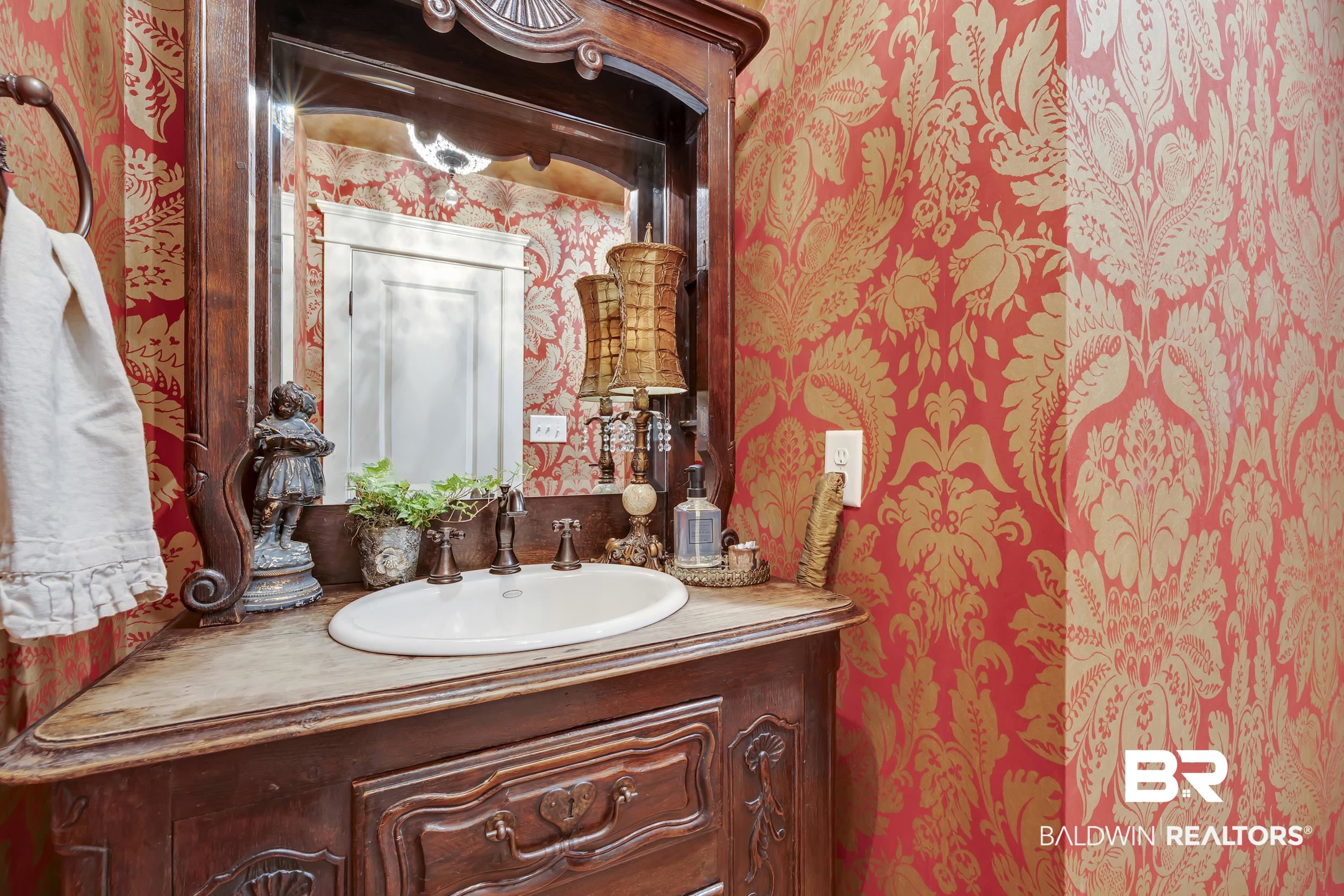 12161 Jessamine Street Magnolia Springs, AL 36555 - Photo 22 of 70 Bathroom with wallpapered walls and vanity