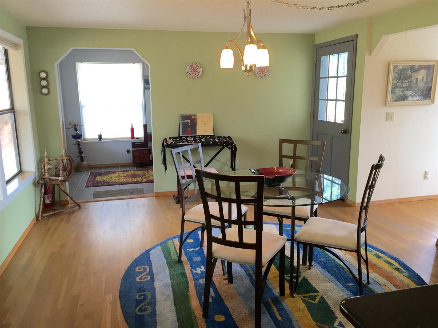 5707 Rockydale Road Cave Junction, OR 97523 - Photo 11 of 35 a view of a dining room with furniture and wooden floor