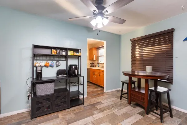 a dining room with furniture and window
