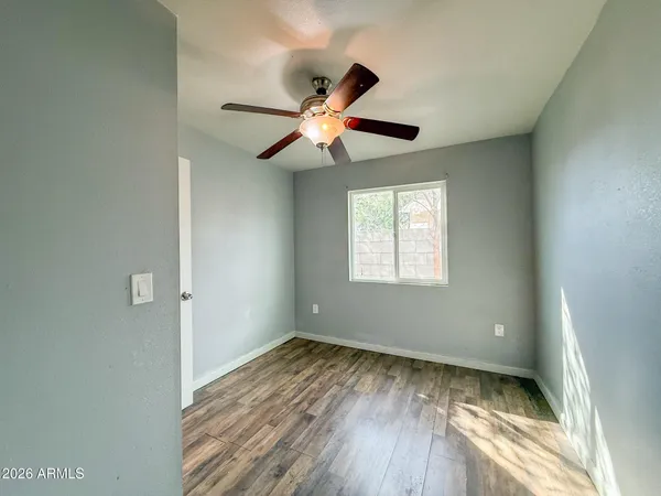 a view of room window and wooden floor