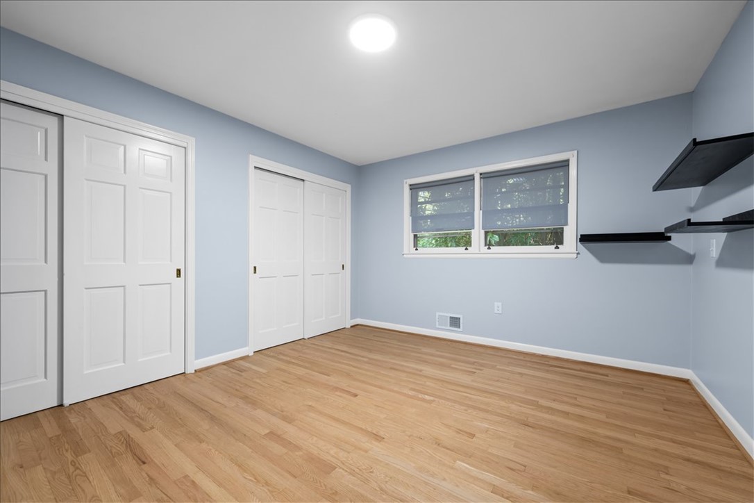 103 Satula Lane Clemson, SC 29631 - Photo 27 of 50 This spacious bedroom offers abundant natural light and ample storage, creating a versatile living space.