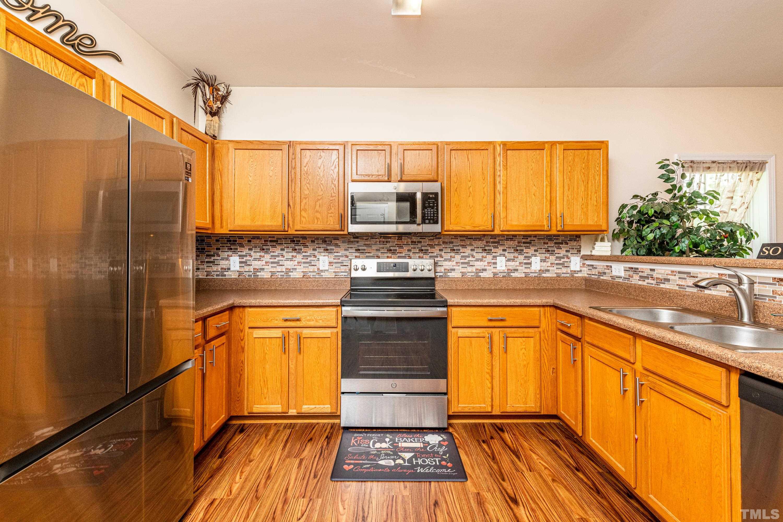 1208 Wall Street Durham, NC 27701 - Photo 11 of 27 a kitchen with granite countertop stainless steel appliances and counter space
