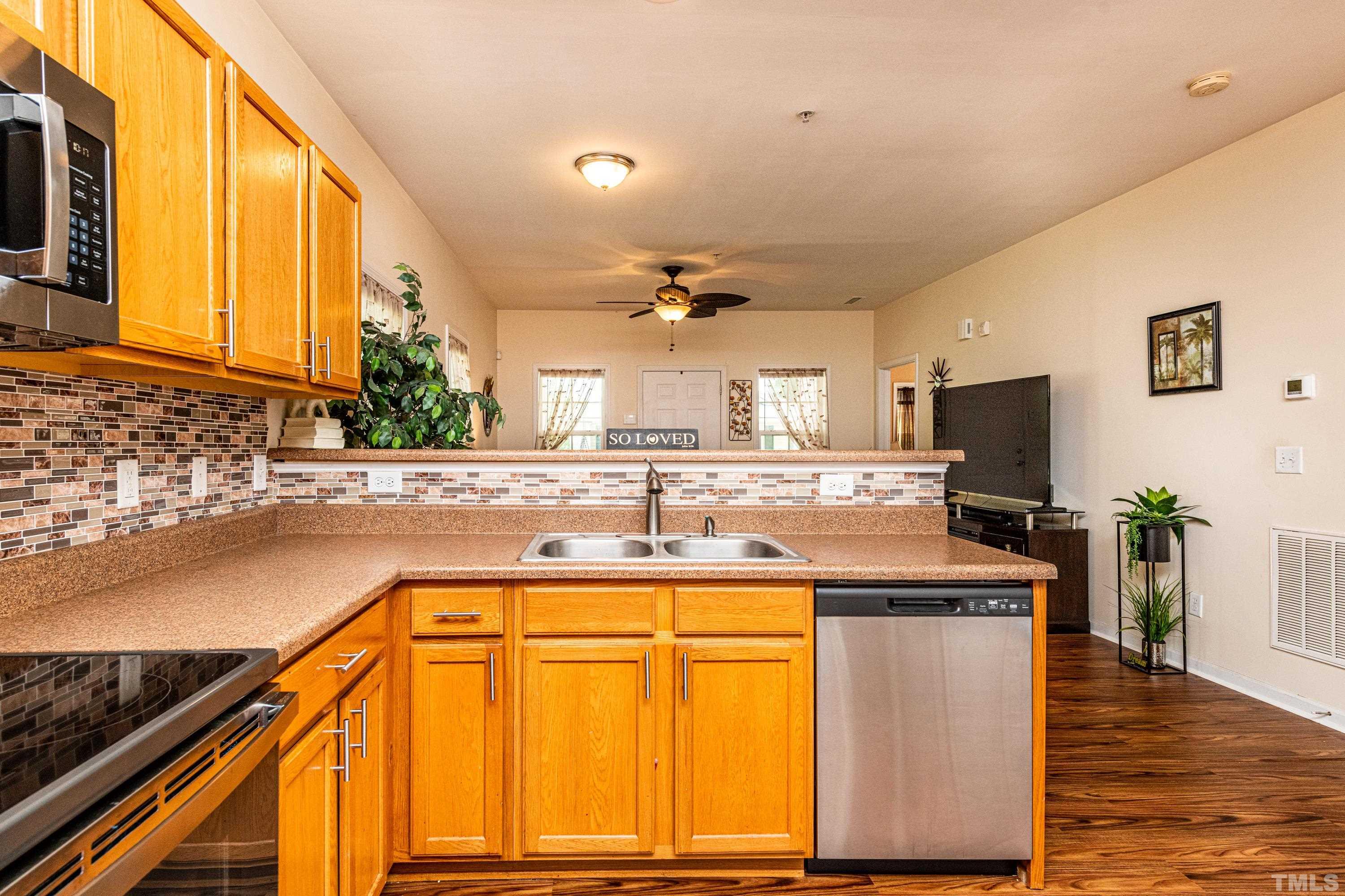 1208 Wall Street Durham, NC 27701 - Photo 15 of 27 a kitchen with a sink and a stove top oven