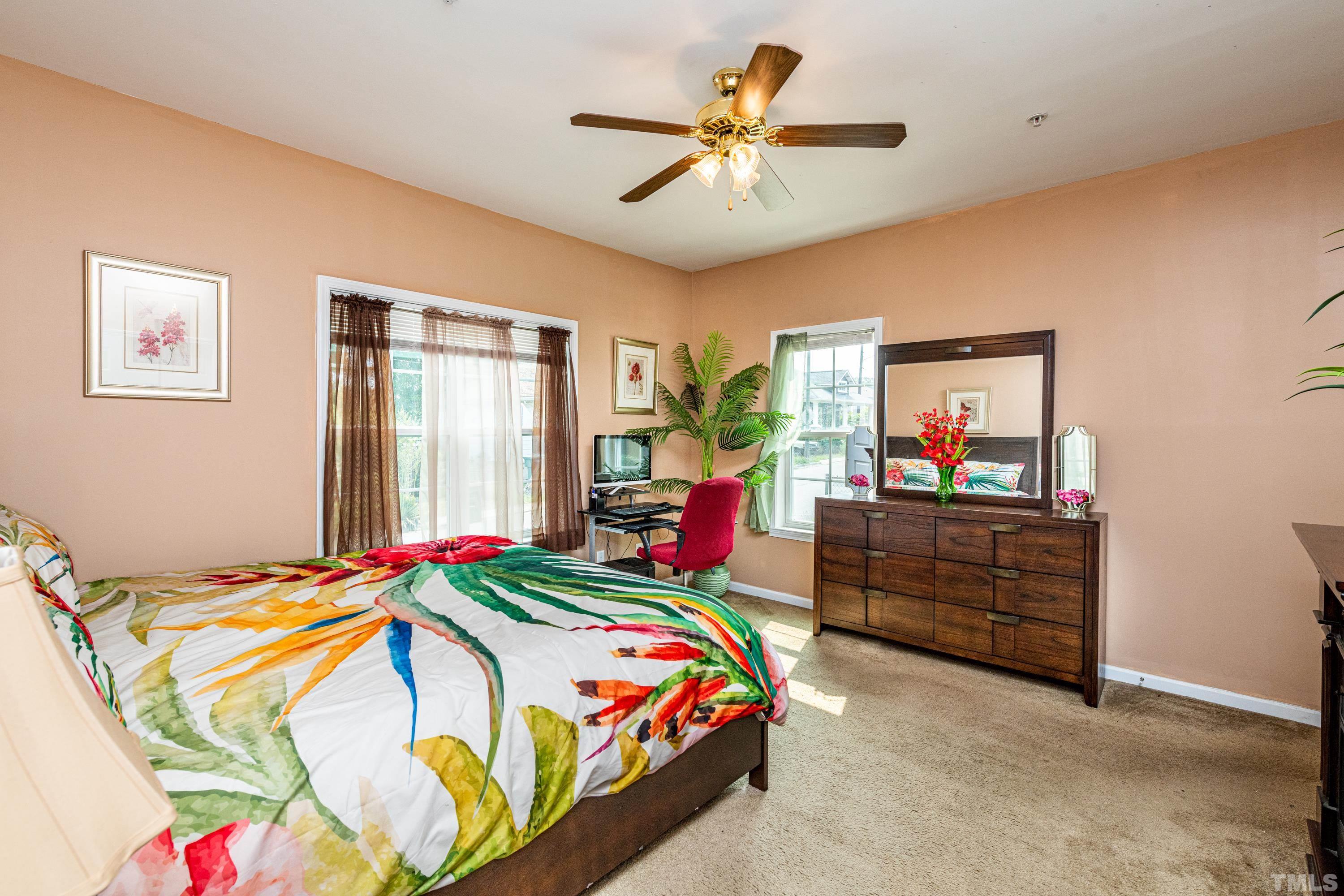 1208 Wall Street Durham, NC 27701 - Photo 17 of 27 a bedroom with a bed and a chandelier