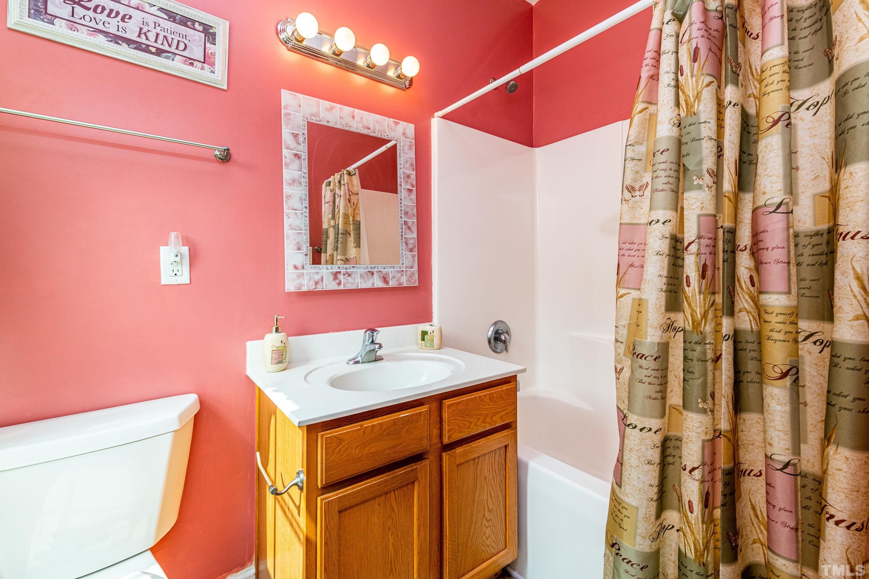 1208 Wall Street Durham, NC 27701 - Photo 18 of 27 a bathroom with a sink vanity granite and a shower