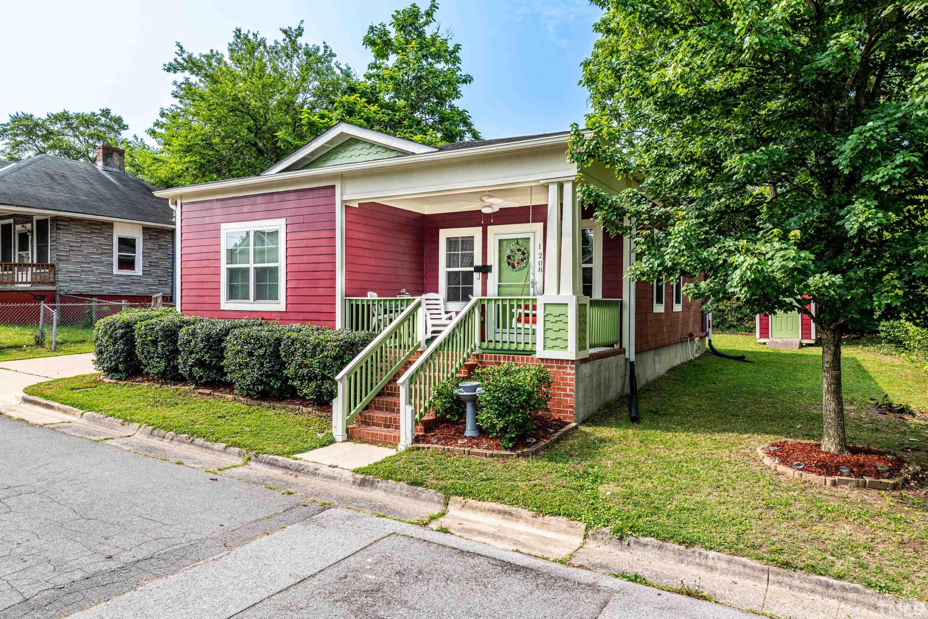 1208 Wall Street Durham, NC 27701 - Photo 3 of 27 a view of a house with a yard and plants