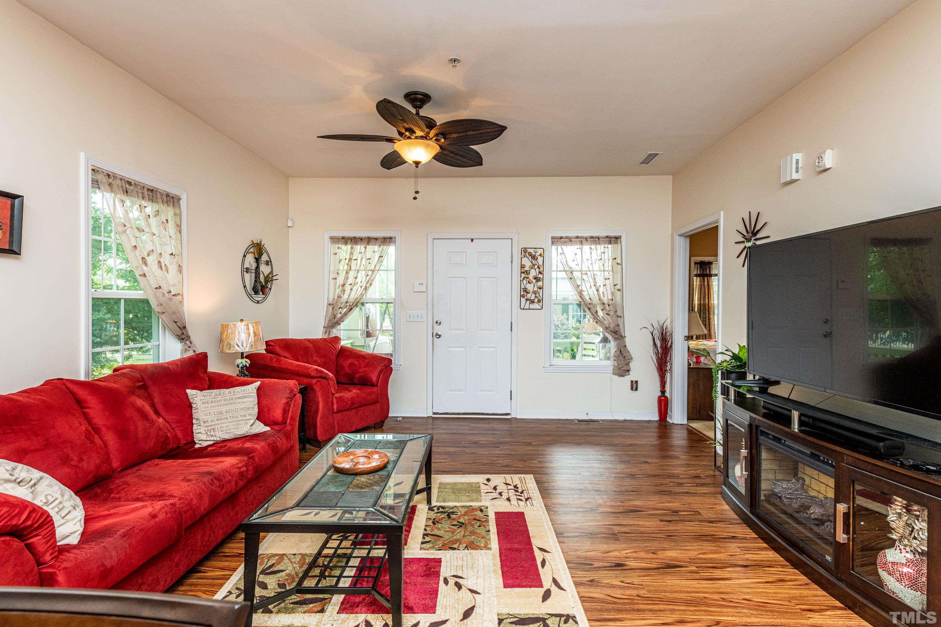 1208 Wall Street Durham, NC 27701 - Photo 6 of 27 a living room with furniture and a flat screen tv