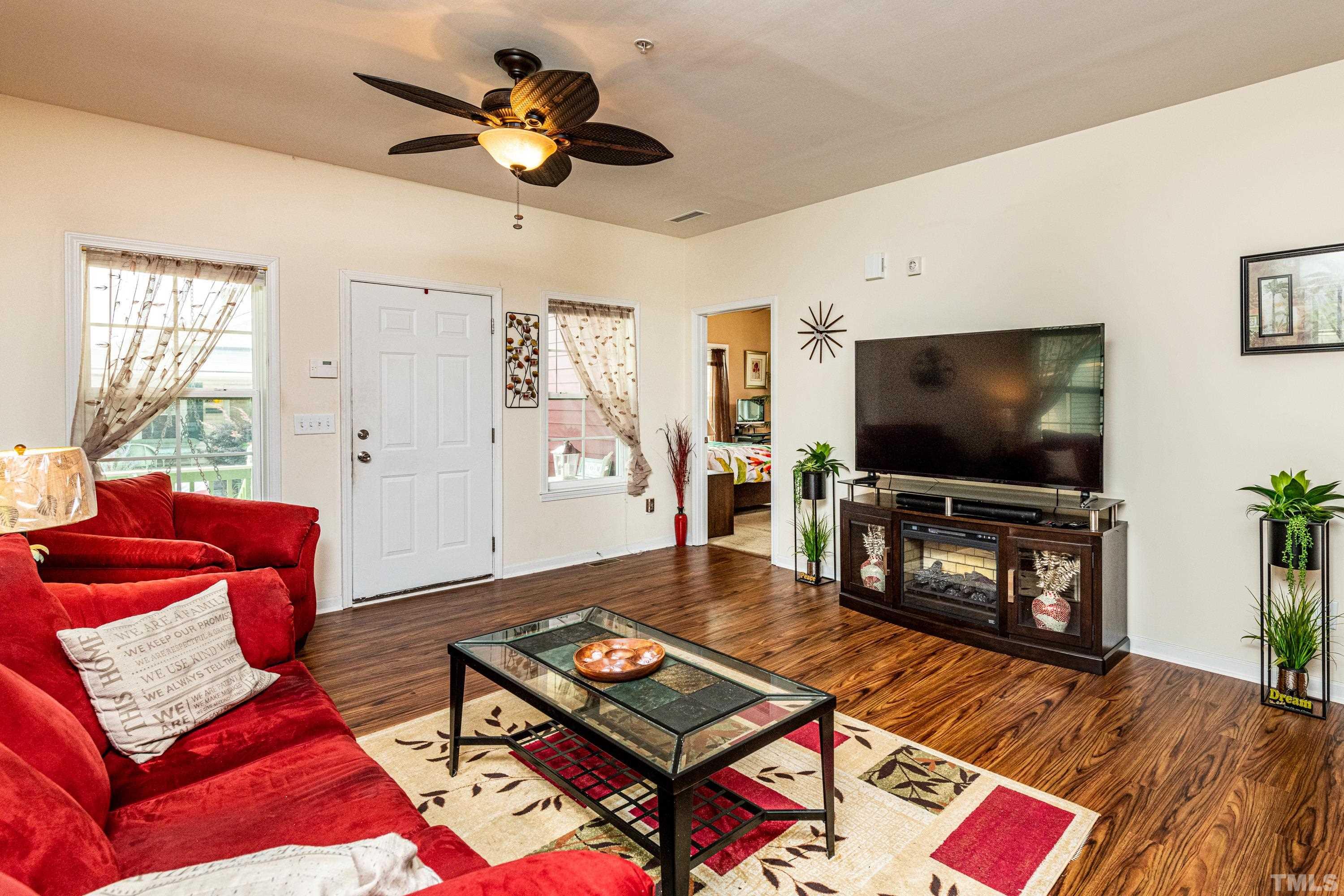 1208 Wall Street Durham, NC 27701 - Photo 7 of 27 a living room with furniture and a flat screen tv