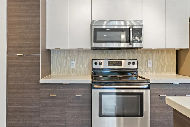 a bathroom with a sink a large mirror and vanity